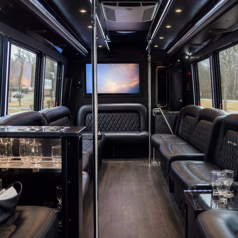 Friends laughing during a Salem party bus celebration