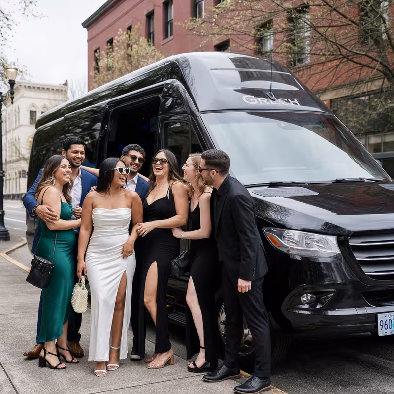 Group boarding a white charter bus for Bachelor & Bachelorette Transportation transportation in Salem