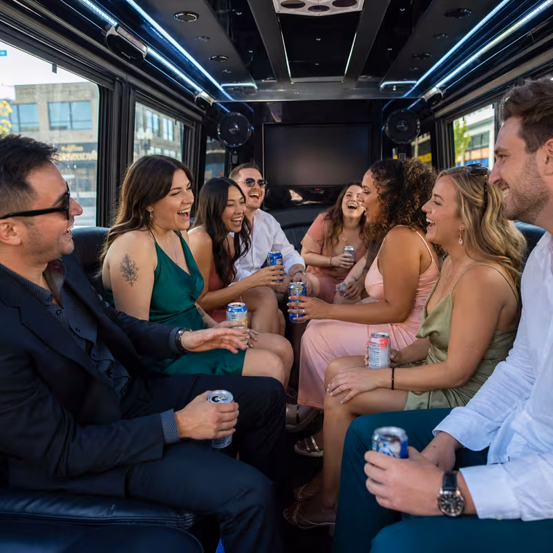 Party bus interior with wraparound leather seating and LED lighting in Salem