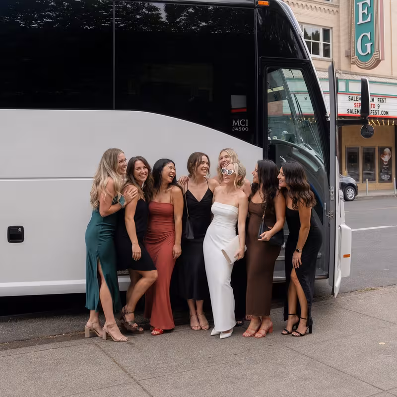 Passengers loading luggage while boarding an Salem group shuttle