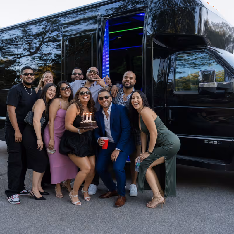 Party bus interior with wraparound leather seating and LED lighting in Salem