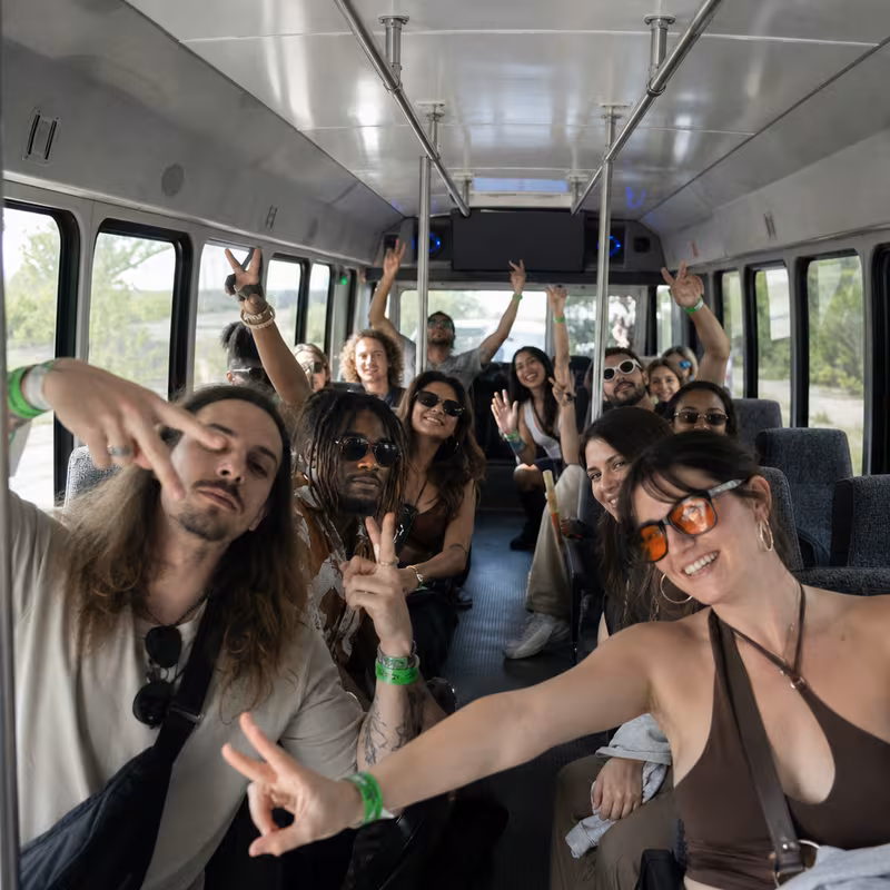 Party bus interior with wraparound leather seating and LED lighting in Salem