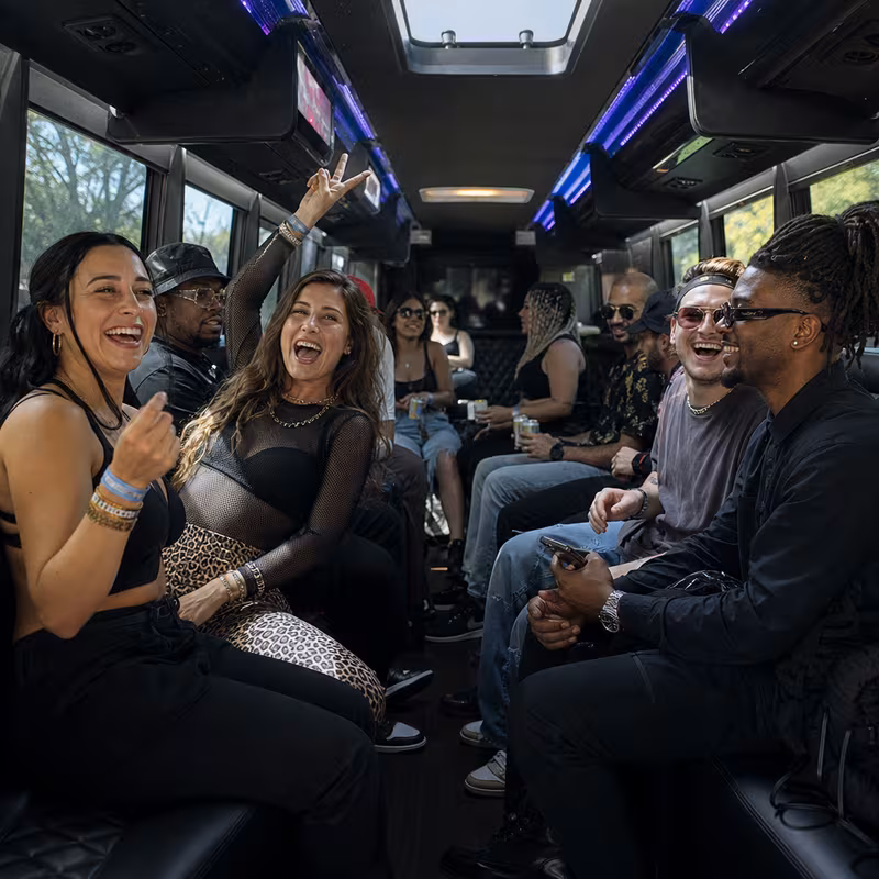 Passengers loading luggage while boarding an Salem group shuttle