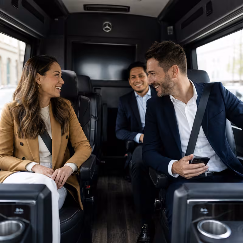 Group boarding a white charter bus for Corporate Transportation transportation in Salem