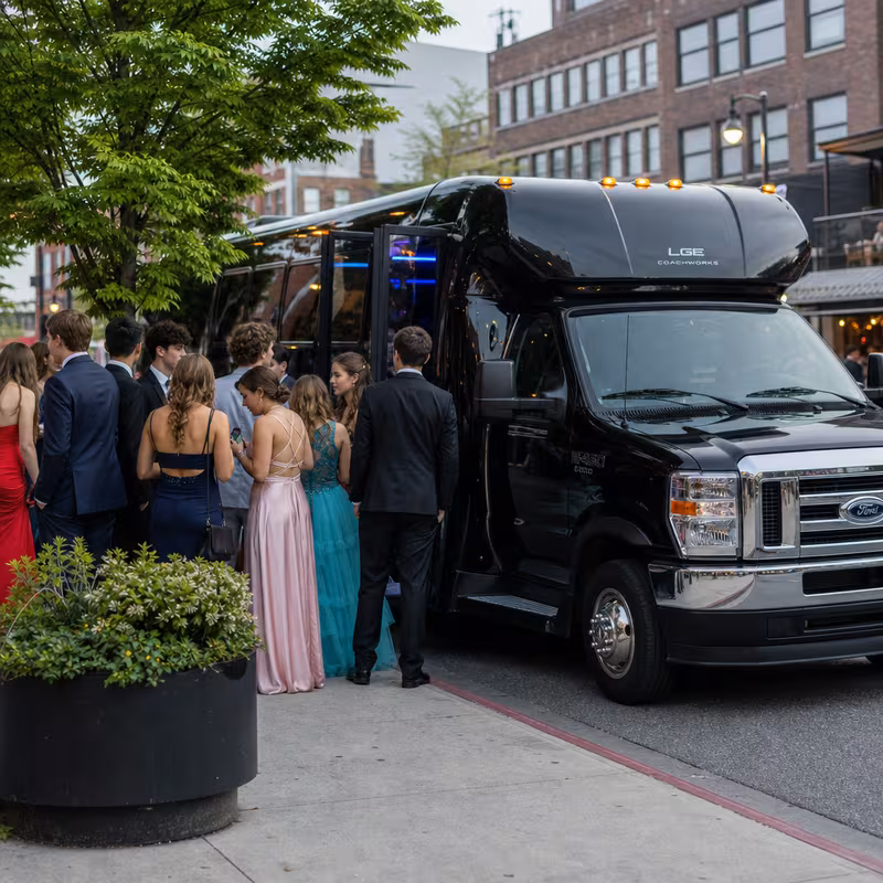 Passengers loading luggage while boarding an Salem group shuttle