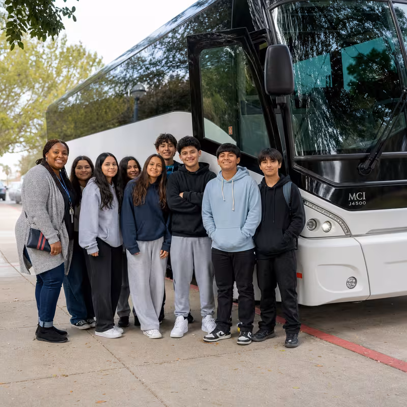 Passengers loading luggage while boarding an Salem group shuttle