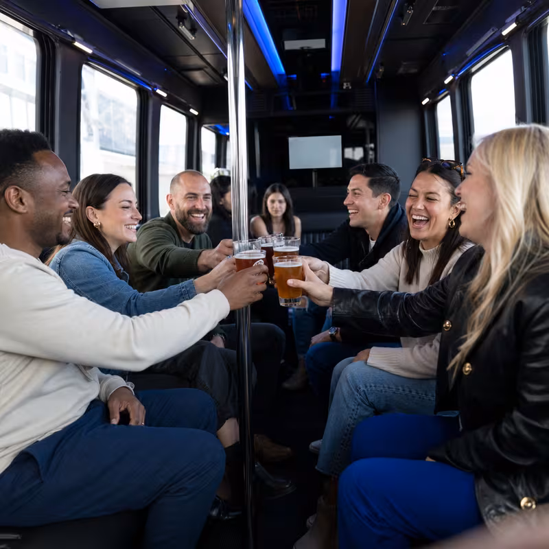 Group boarding a white charter bus for Winery & Brewery Tour Transportation transportation in Salem